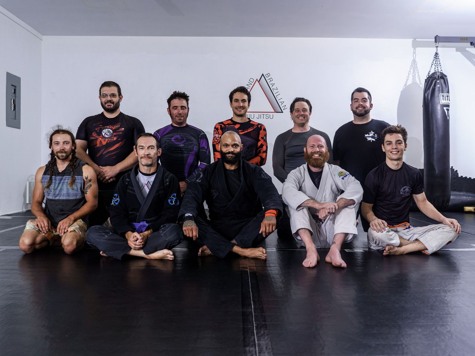 Adult jiu jitsu class lined up on the mats at Rossland Martial Arts